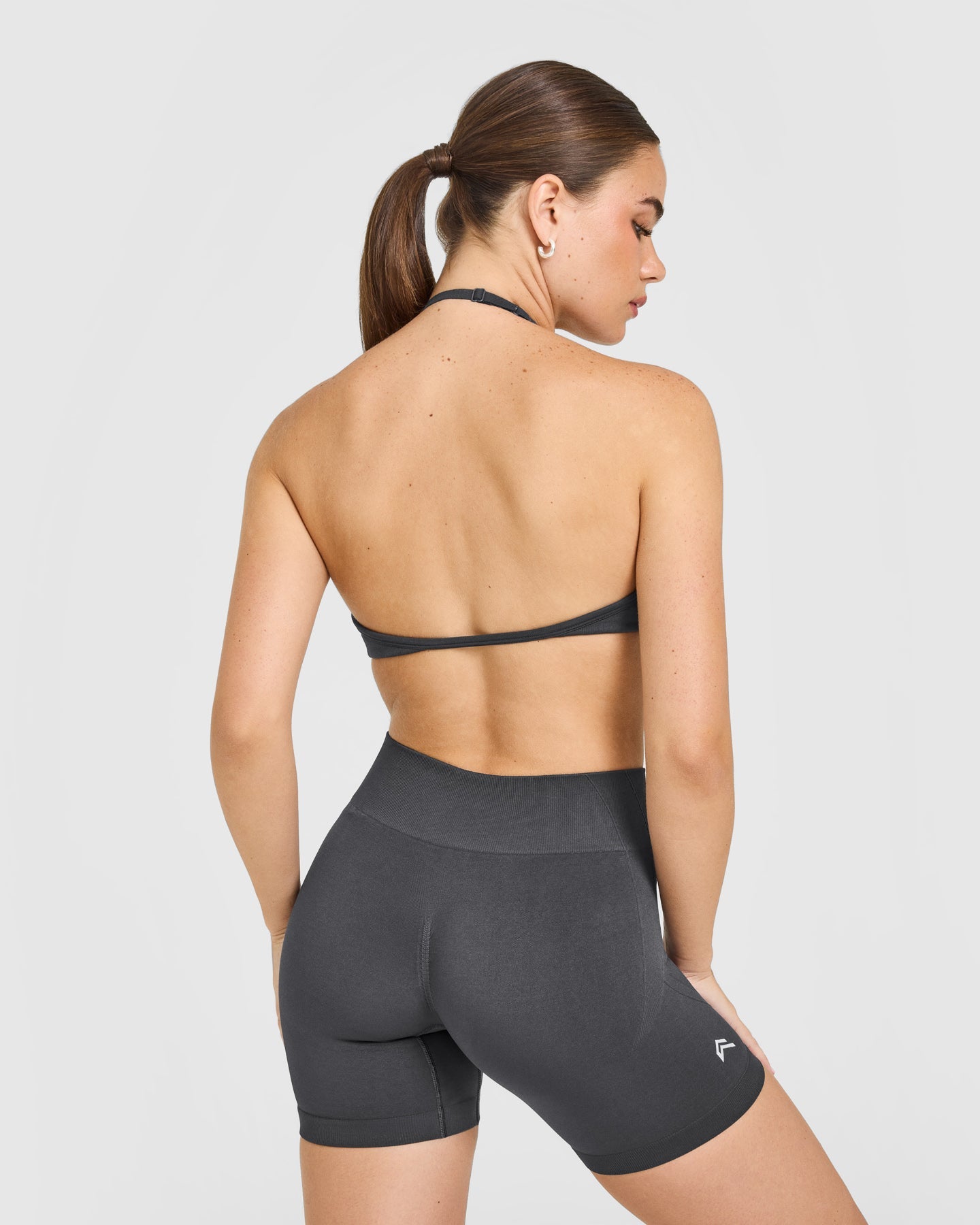 EnhanceLift Seamless Minimal Halter Neck Bralette with White Logo | Coal - Image 2