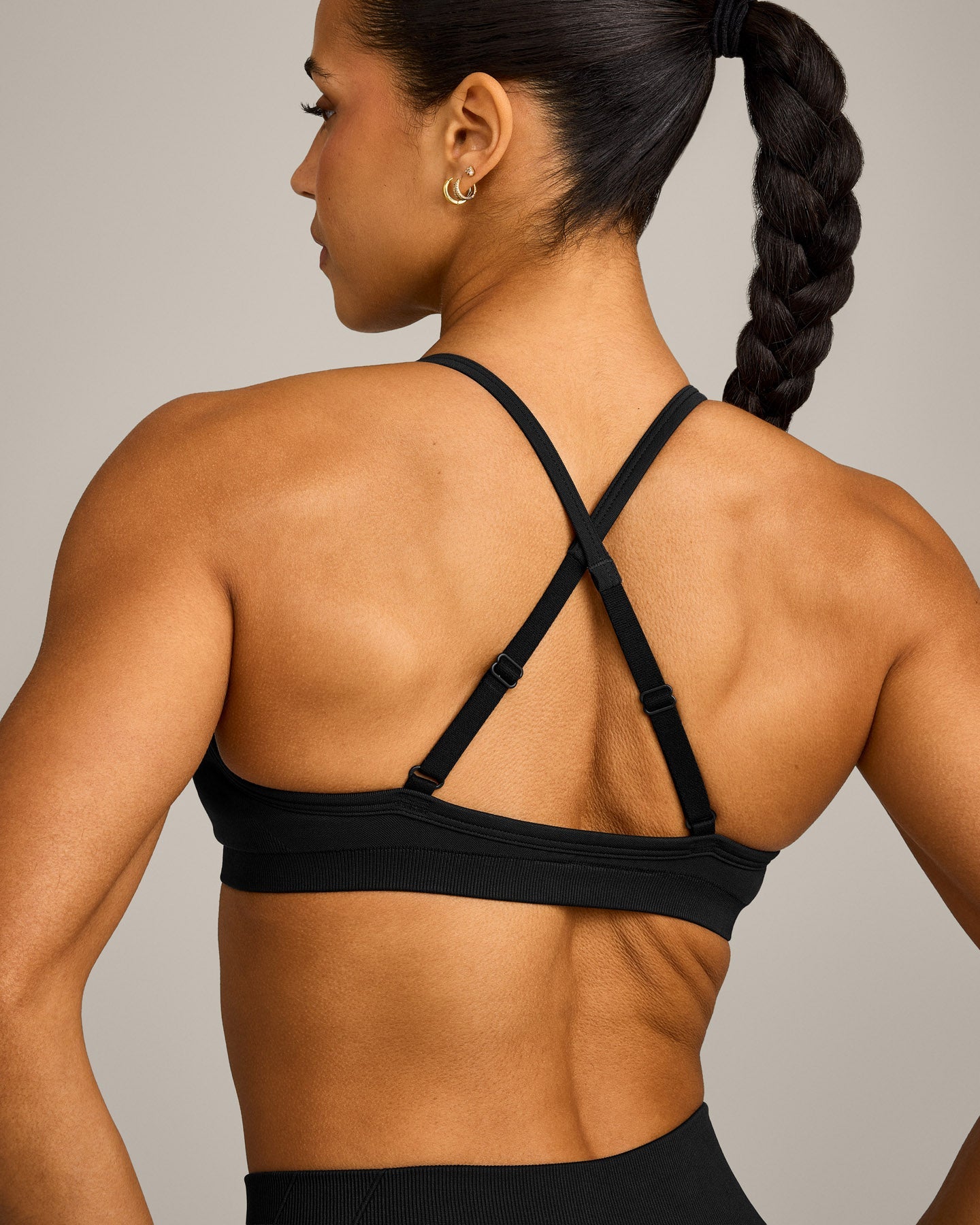 EnhanceLift Seamless Strappy Sports Bra with Grey Logo | Black - Image 2